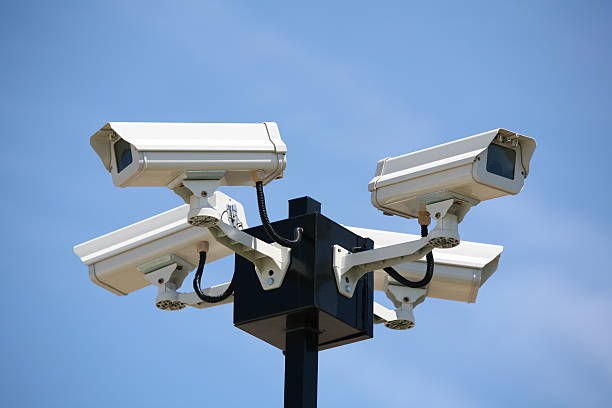 four surveillance cameras mounted on the pole to oversee construction sitesee also: